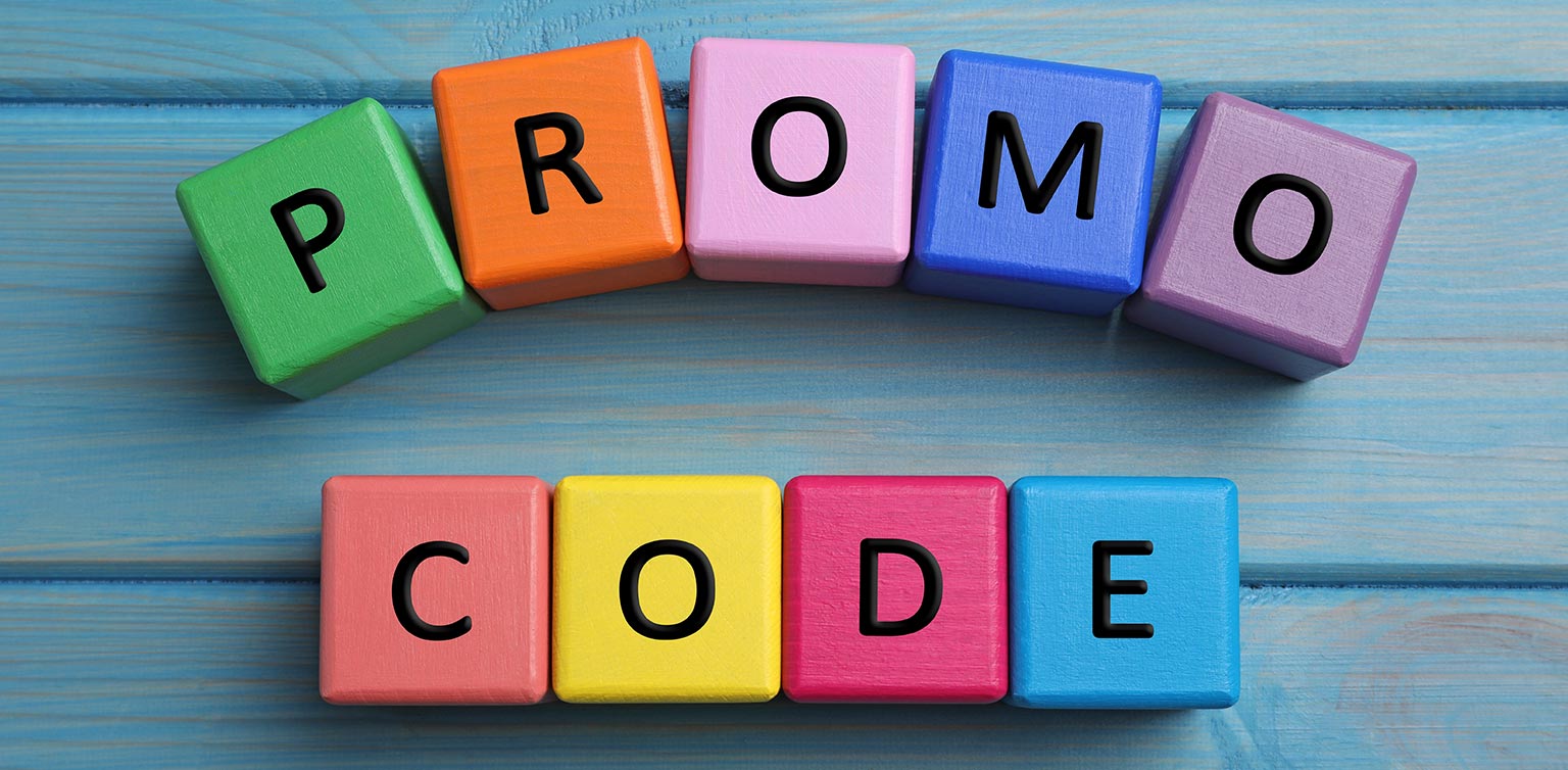 A photo of colorful wooden blocks spelling ‘promo code’ on a blue wooden surface 